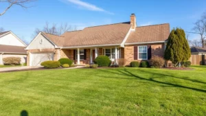 mchenry county property tax - A peaceful suburban home in Illinois with a well-maintained lawn and blue sky, n